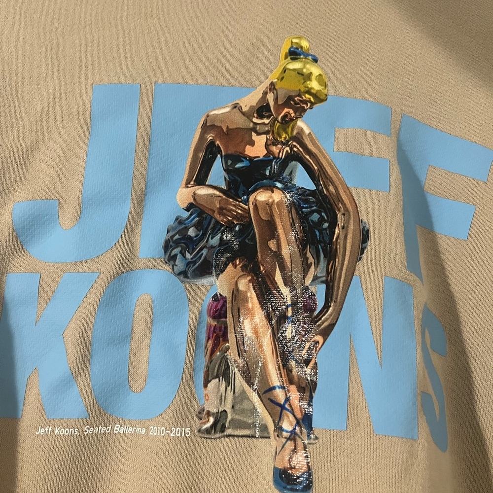 Uniqlo Beige Sweater with Blue and Yellow Graphic